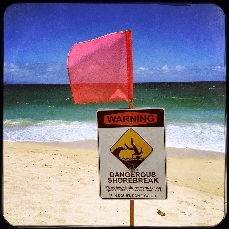 dangerous shore break beach sign